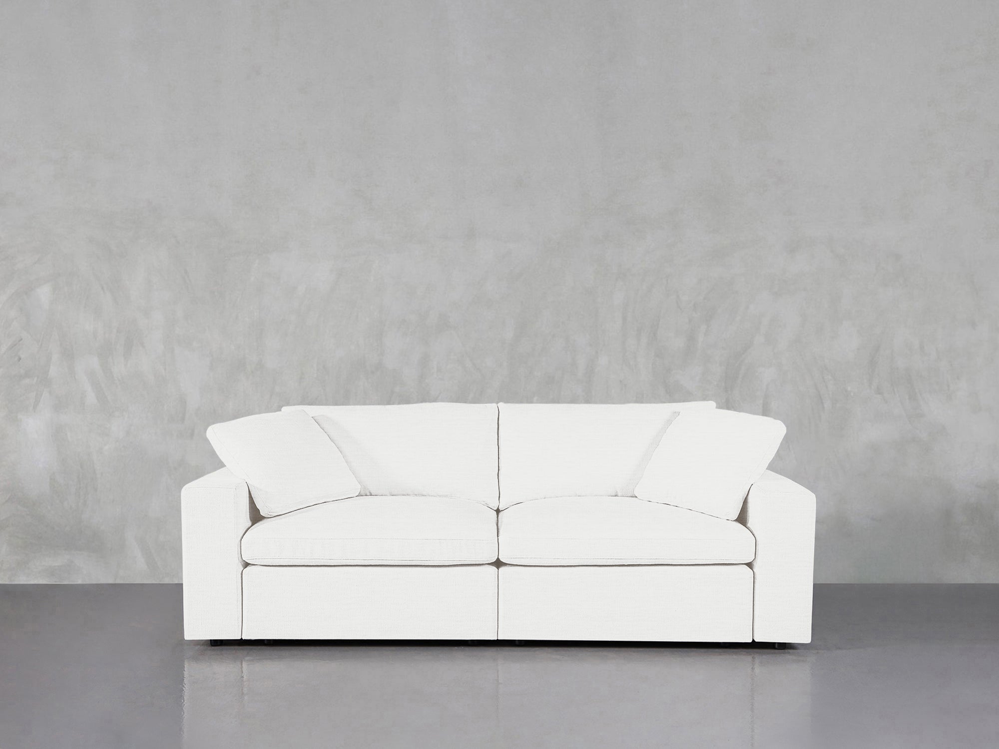 White sofa with unsettling wall