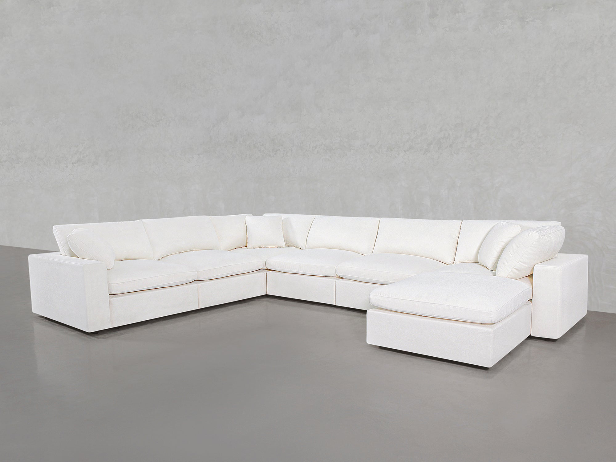 White sectional with chaise and ottoman