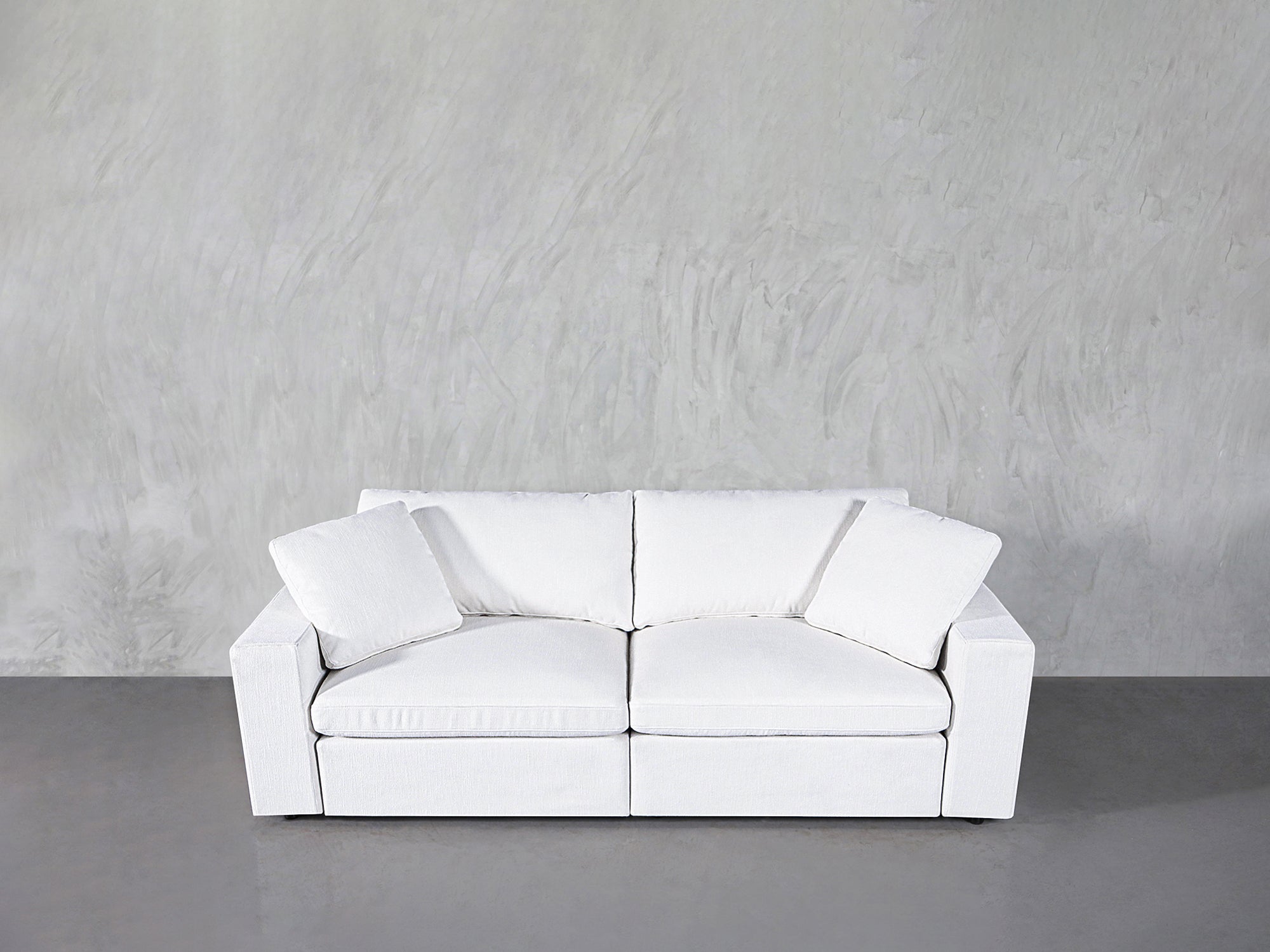 Front view of white loveseat with two cushions