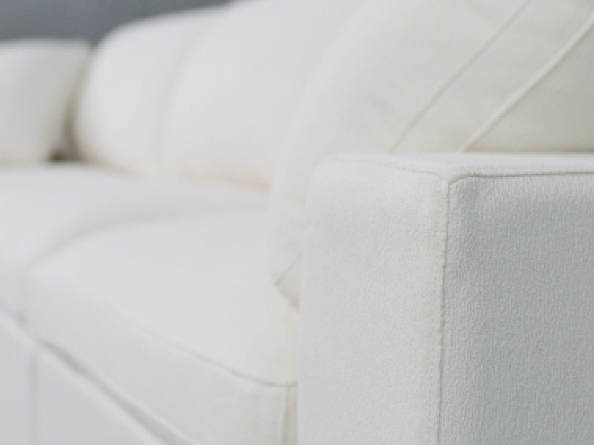 Close-up of cushion seam on sofa
